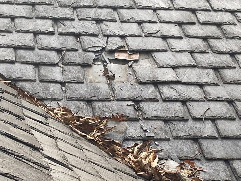 Old, damaged slate roof in Richmond VA.