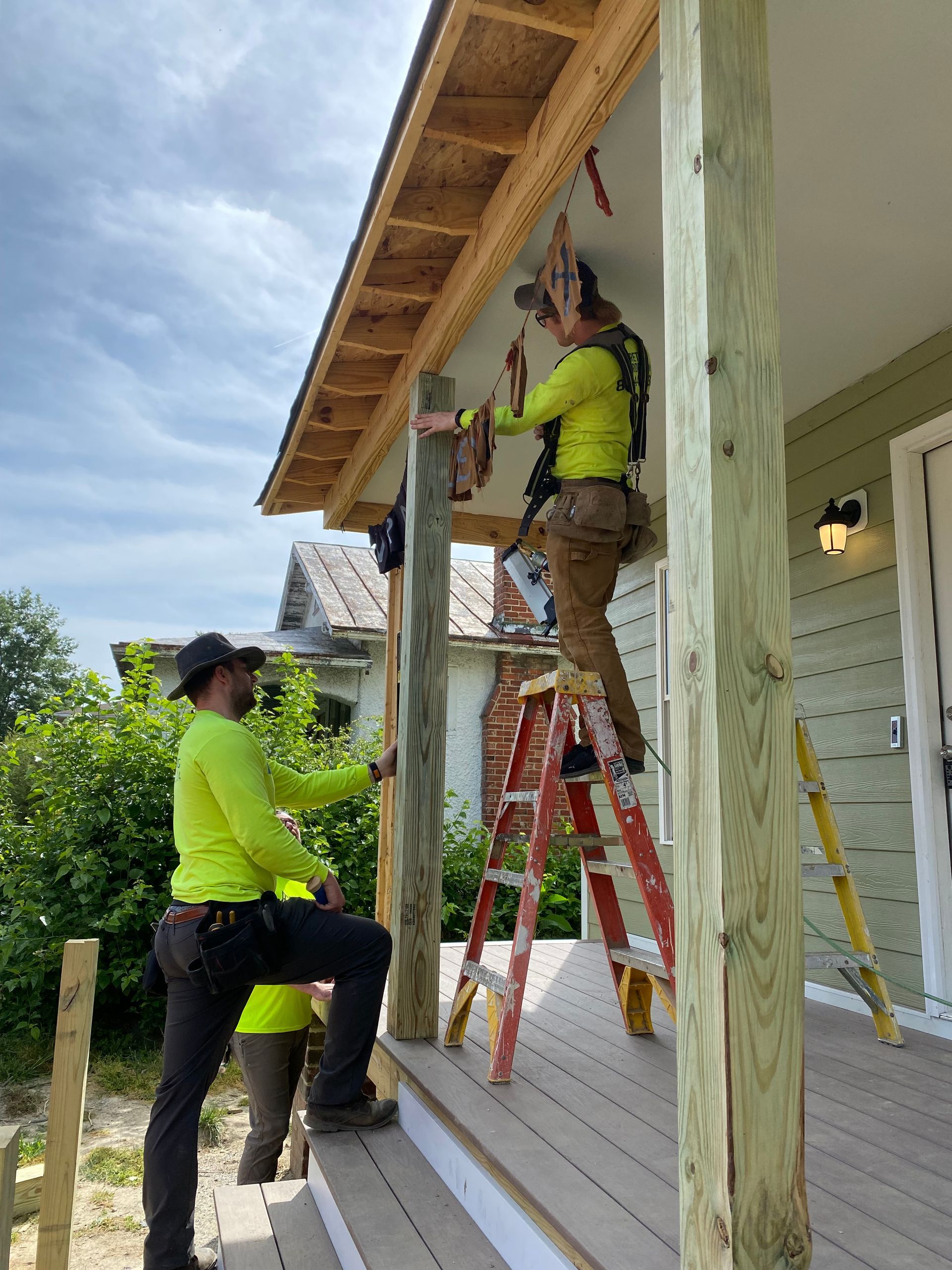 Image of RETEX’s Josh Lewis and Caleb Hennon volunteering with Richmond Habitat for Humanity in May 2023.
