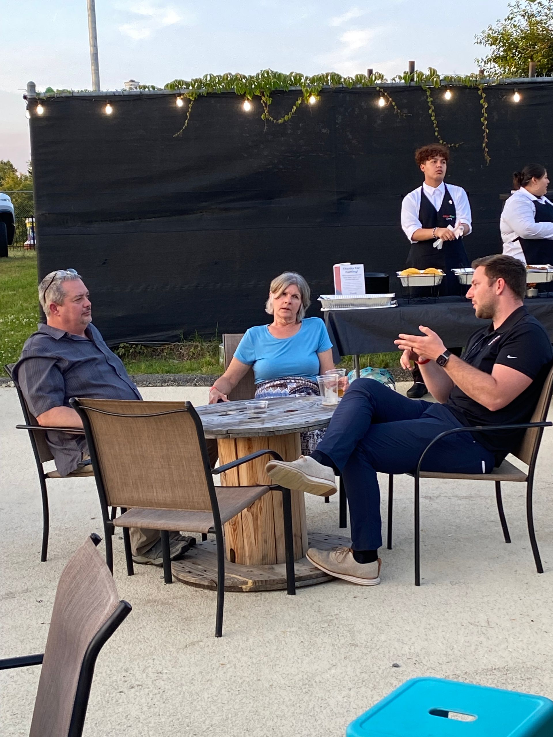 An image of RETEX's Josh Lewis chatting with past clients at our June Client Appreciation event in 2023.