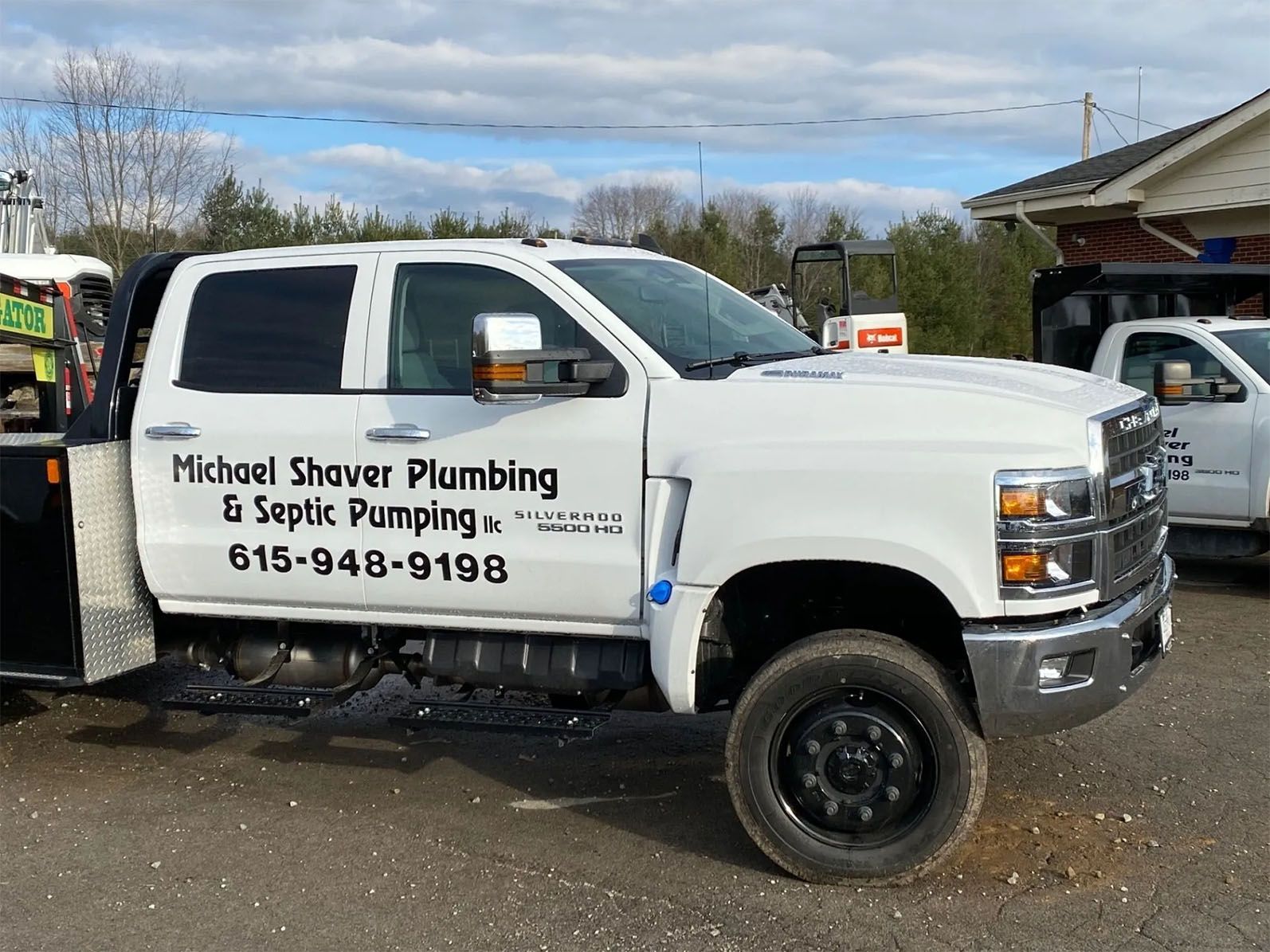 Side view of company pick up truck — Bethpage, TN — Michael Shaver Plumbing & Septic Pumping