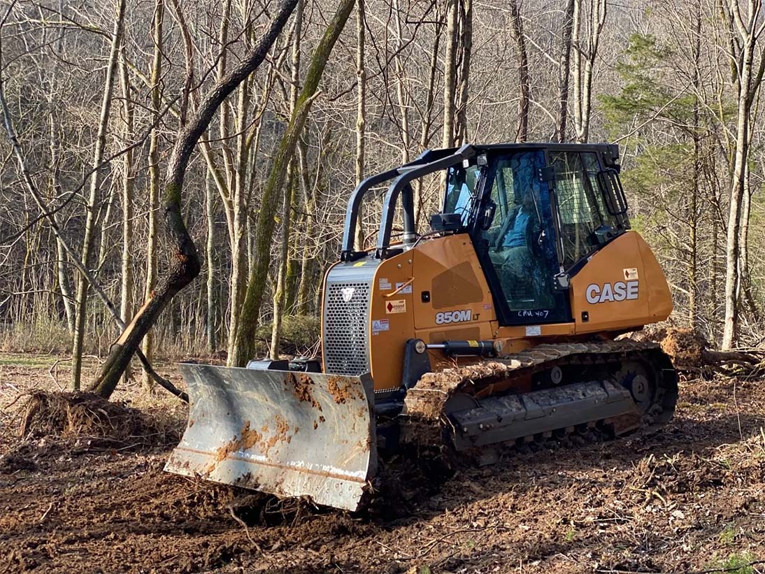 Bulldozer parked — Bethpage, TN — Michael Shaver Plumbing & Septic Pumping