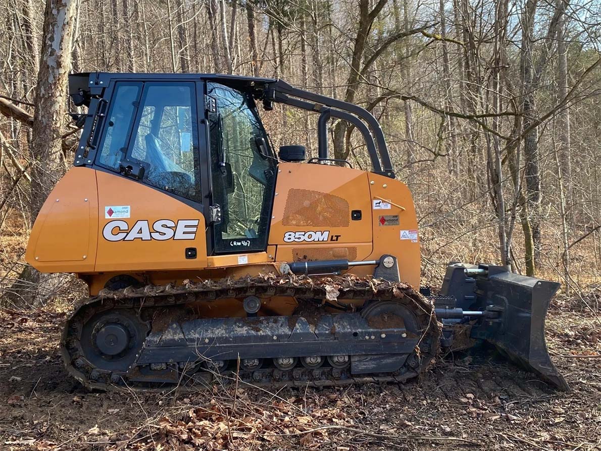 Excavator on forest — Bethpage, TN — Michael Shaver Plumbing & Septic Pumping