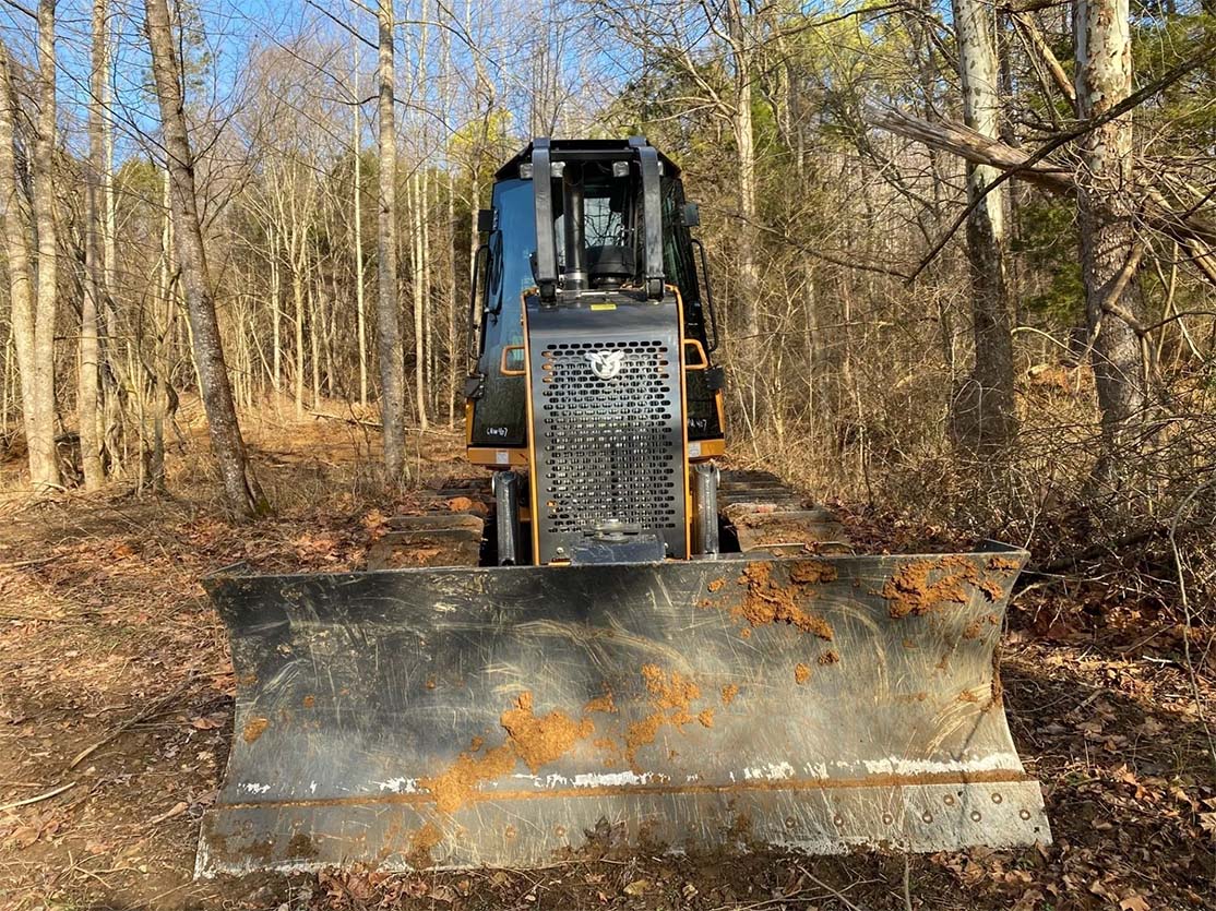 Front view of excavator — Bethpage, TN — Michael Shaver Plumbing & Septic Pumping