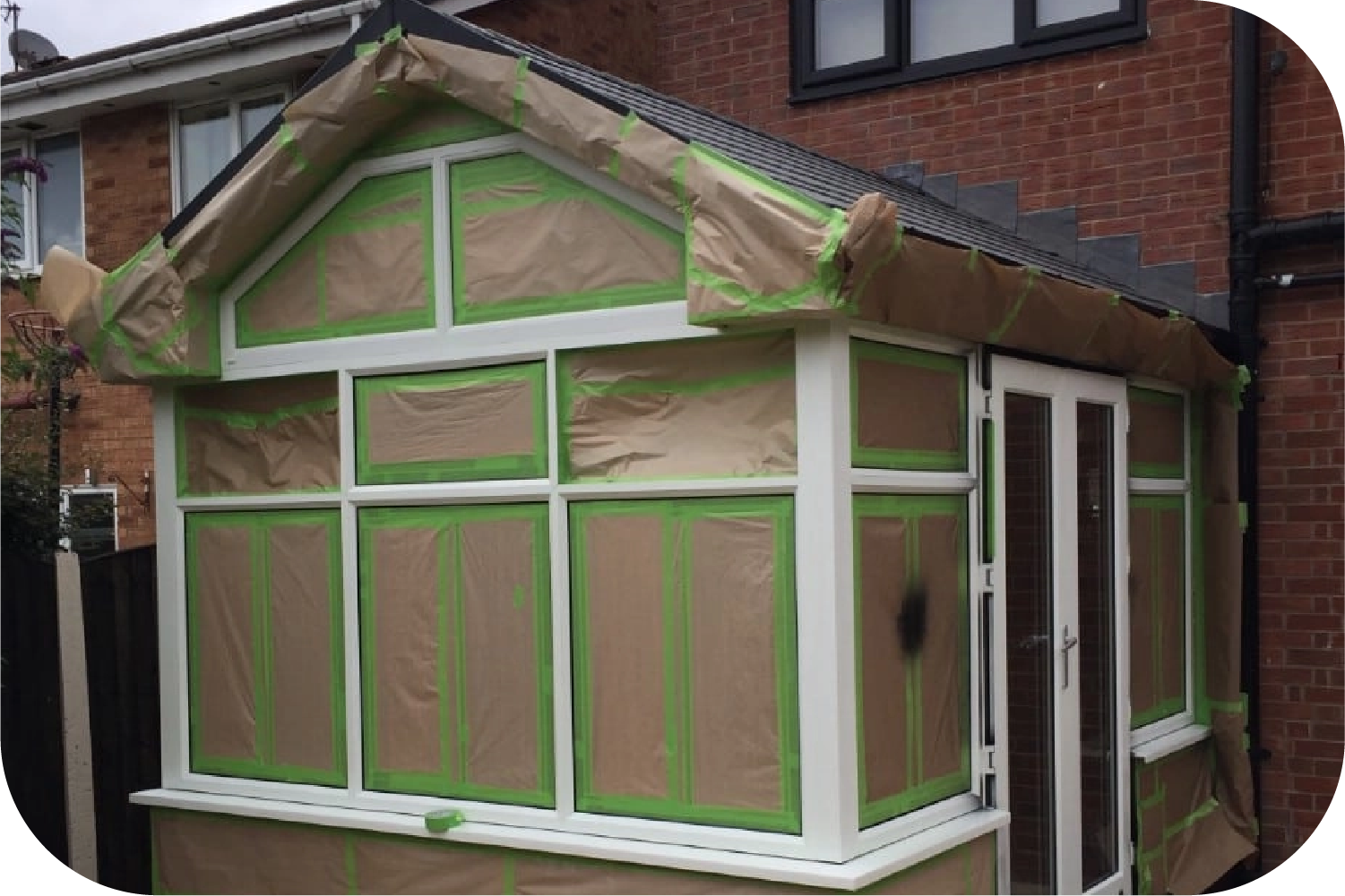 An attic with a pipe covered in aluminum foil