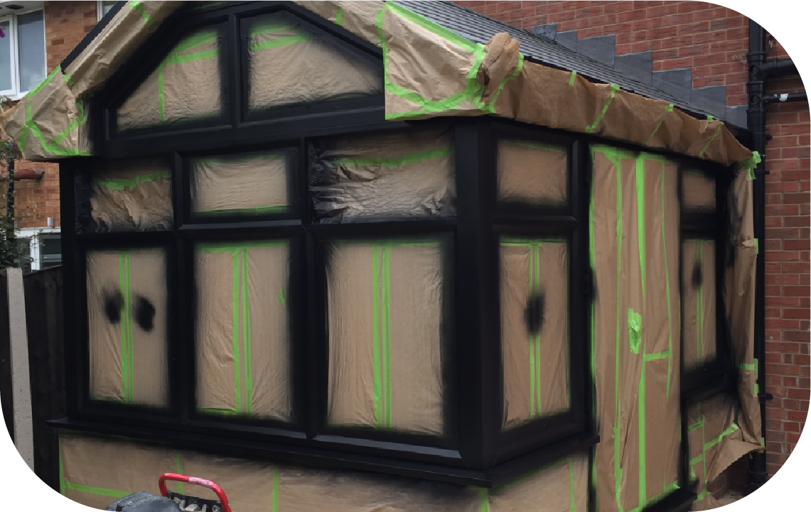 An attic with a pipe covered in aluminum foil