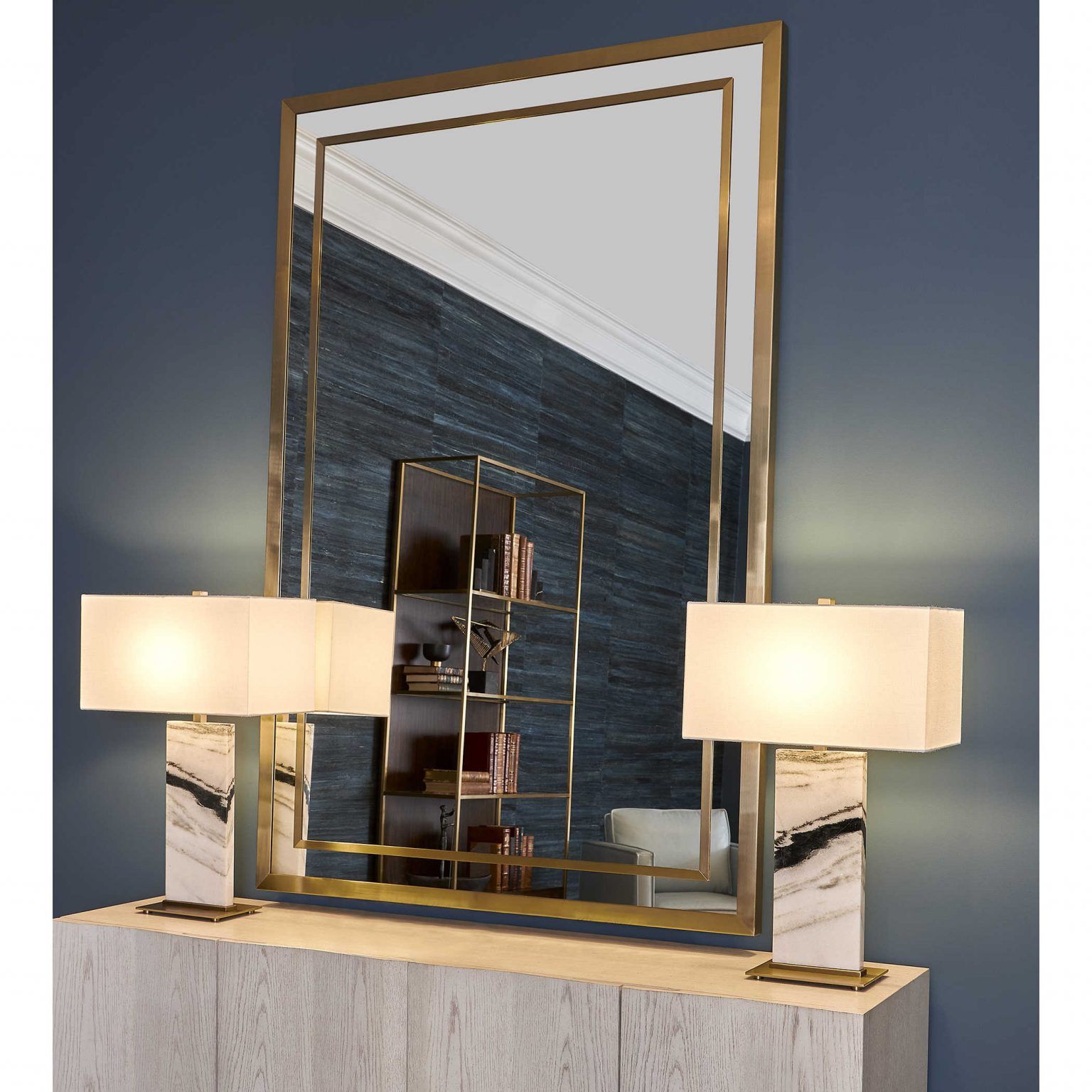 Gold lined mirrors with gold and lamps bring a retro-modern glow