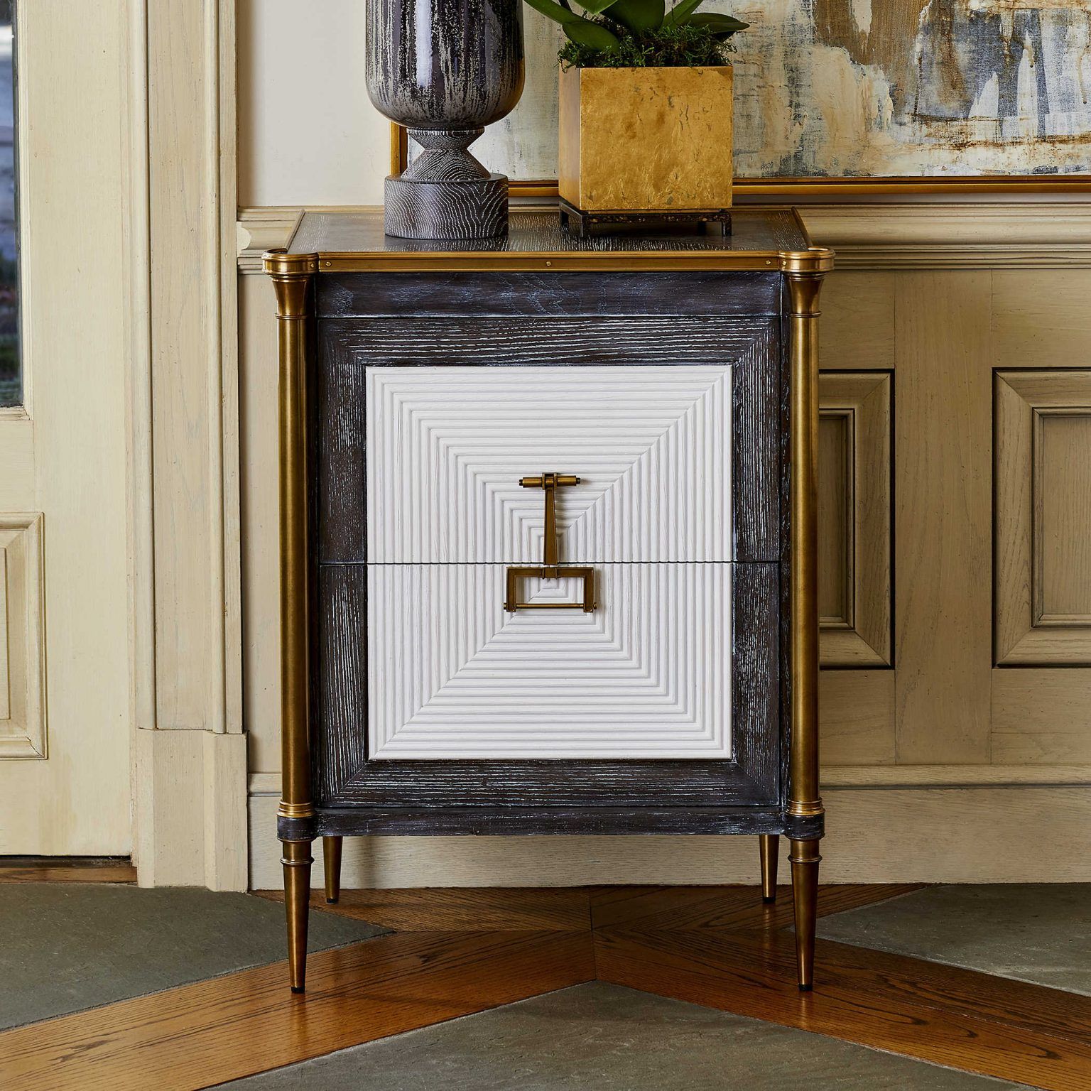 Antique-looking side table with gold and white detailing is granny chic