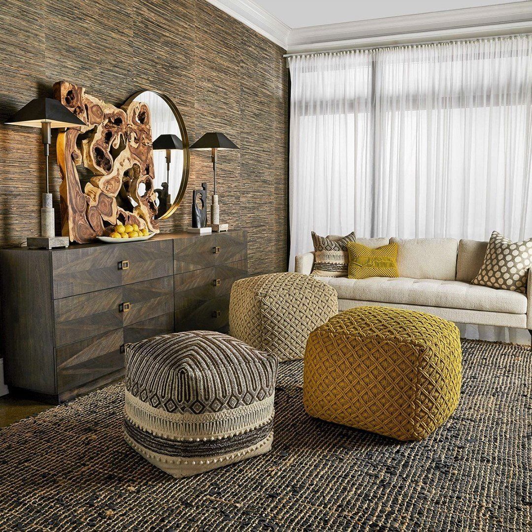 Cozy oversized ottoman's bring warmth to this chic room with their mustard-yellow hue