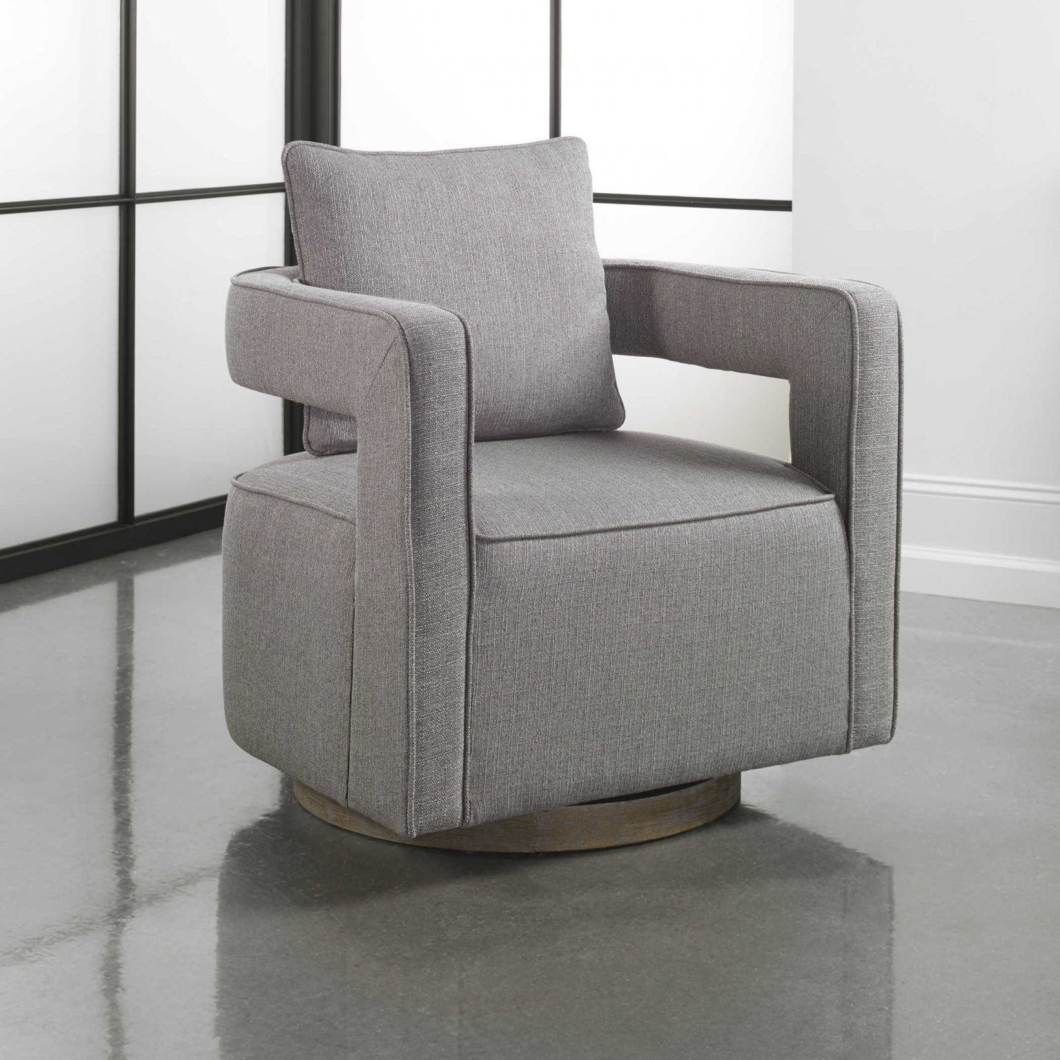 Nostalgic grey swivel chair inspired by the 1970's would look fantastic in a granny chic living room or office