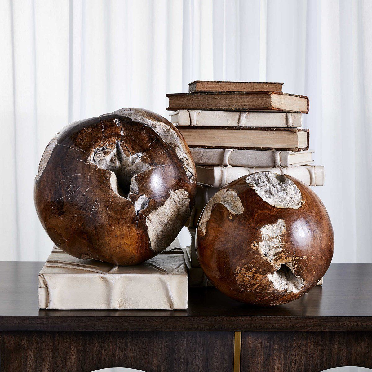 Reclaimed teak wood balls give a retro feel with their geometric shapes