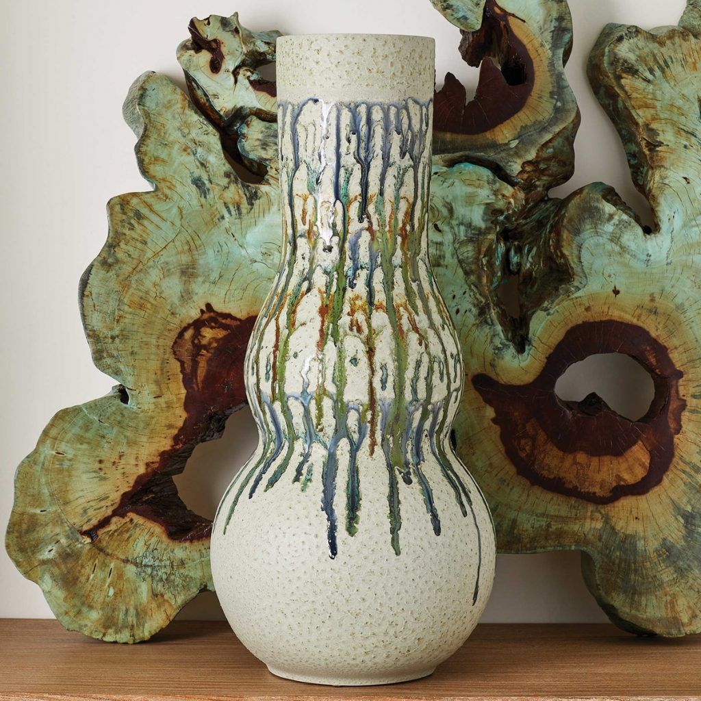 Retro wavy ceramic vase and petrified wood interior decor