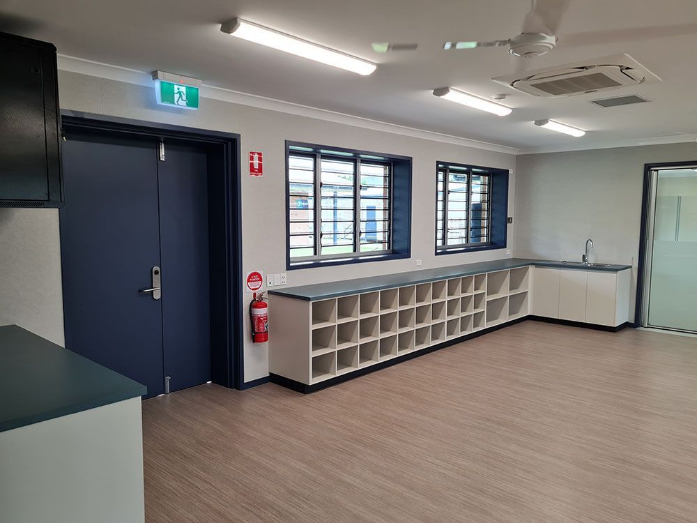 Classroom With Blue Door — Award-Winning Builders in Townsville, QLD