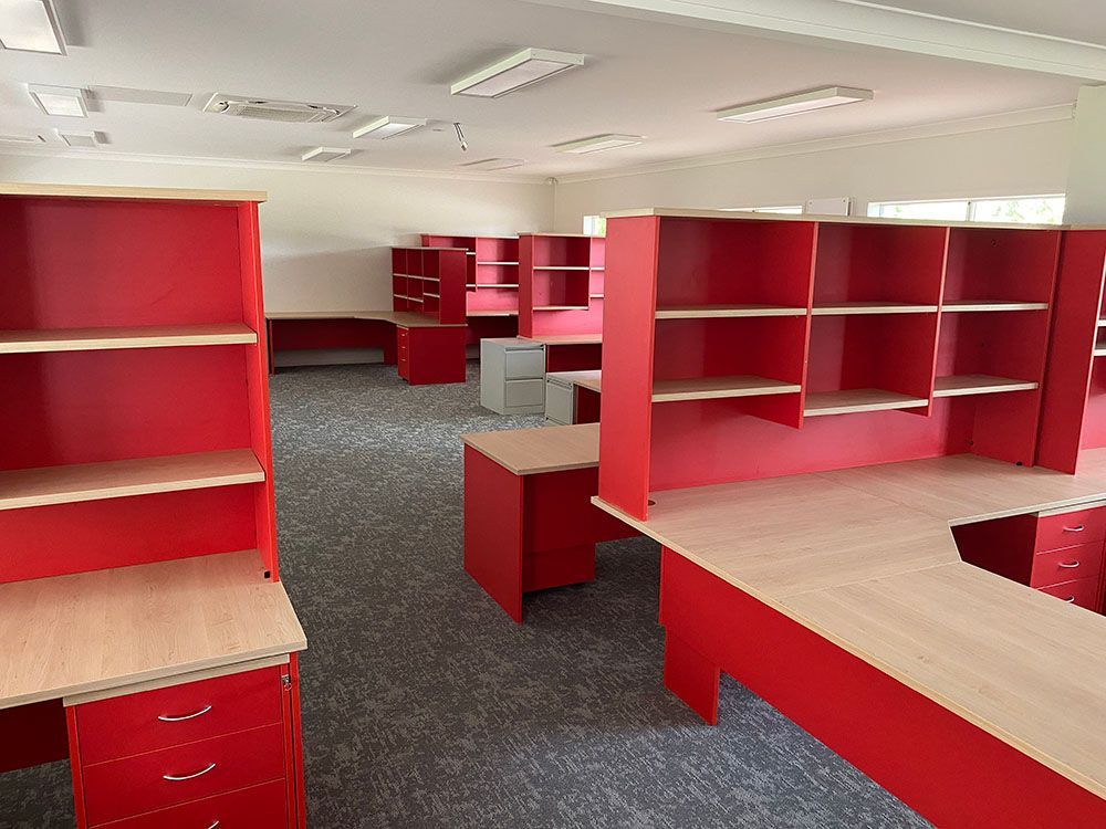 Classroom With Red Desks — Award-Winning Builders in Townsville, QLD