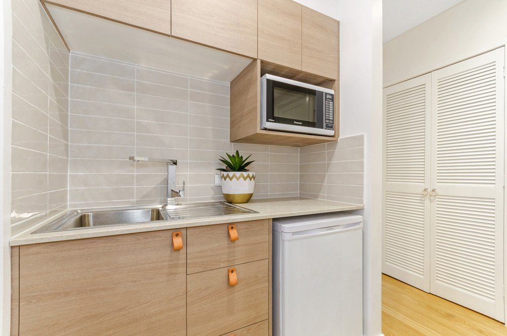 Pallarenda Beach House Kitchen with Appliances — Award-Winning Builders in Townsville, QLD