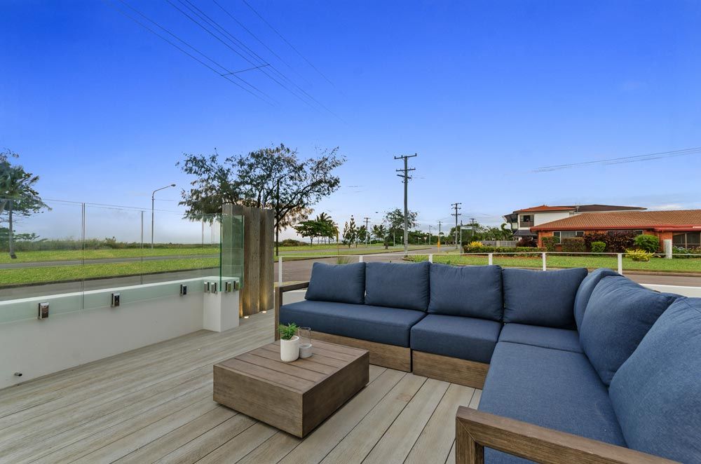 Pallarenda Beach House Sofa on the Deck — Award-Winning Builders in Townsville, QLD