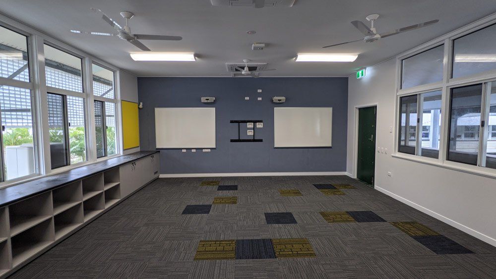 Classroom with Grey Wall — Award-Winning Builders in Townsville, QLD