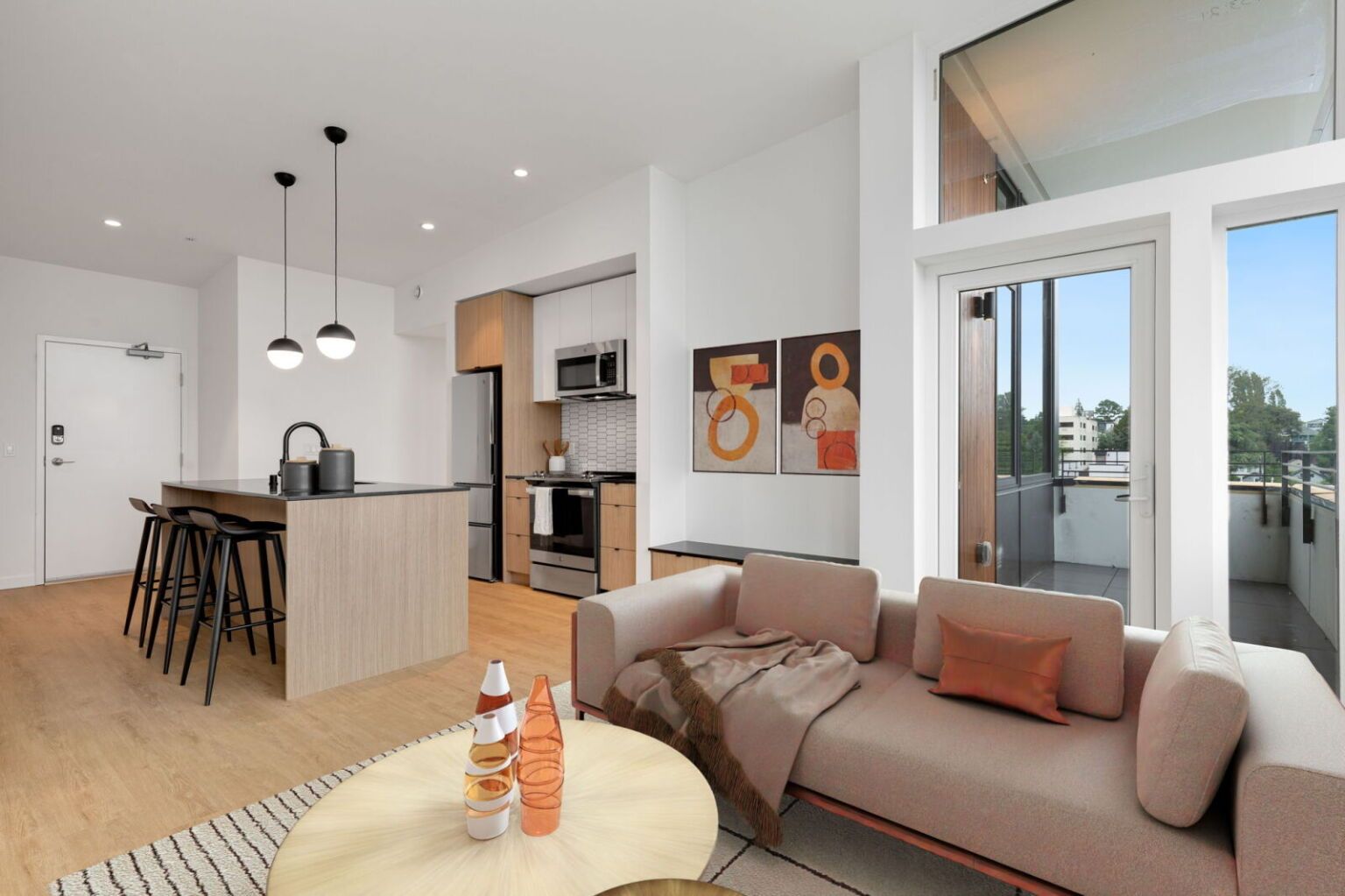 Modern apartment interior with kitchen, living area, balcony, and neutral tones.