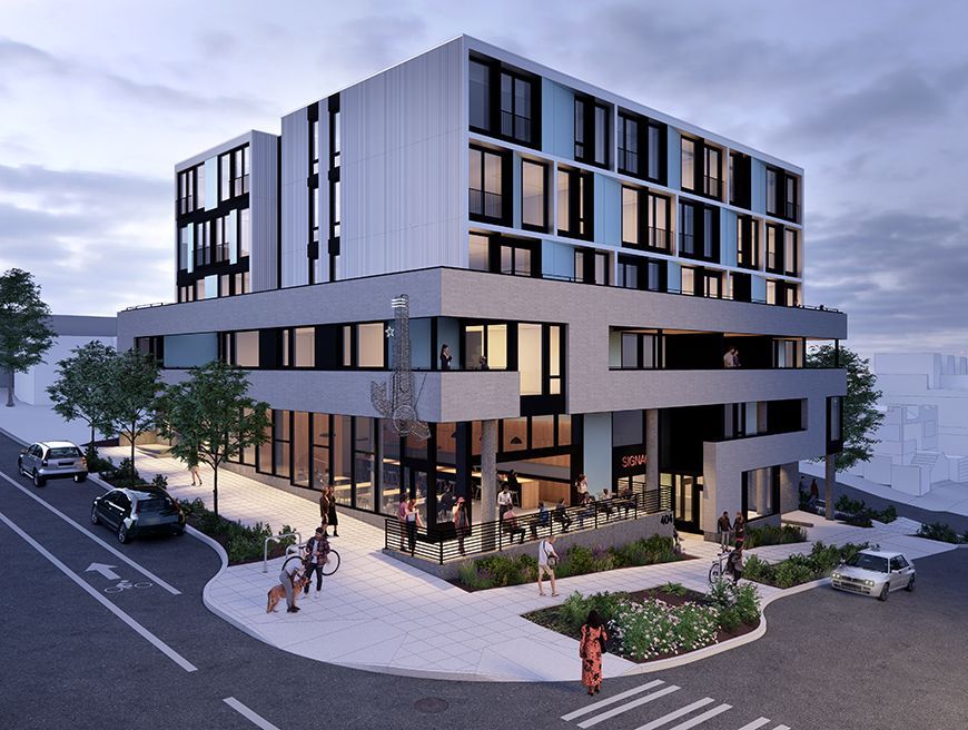 Modern multi-story building with storefront, sidewalk, and pedestrians. Blue, gray, and white facade. Cars on street.