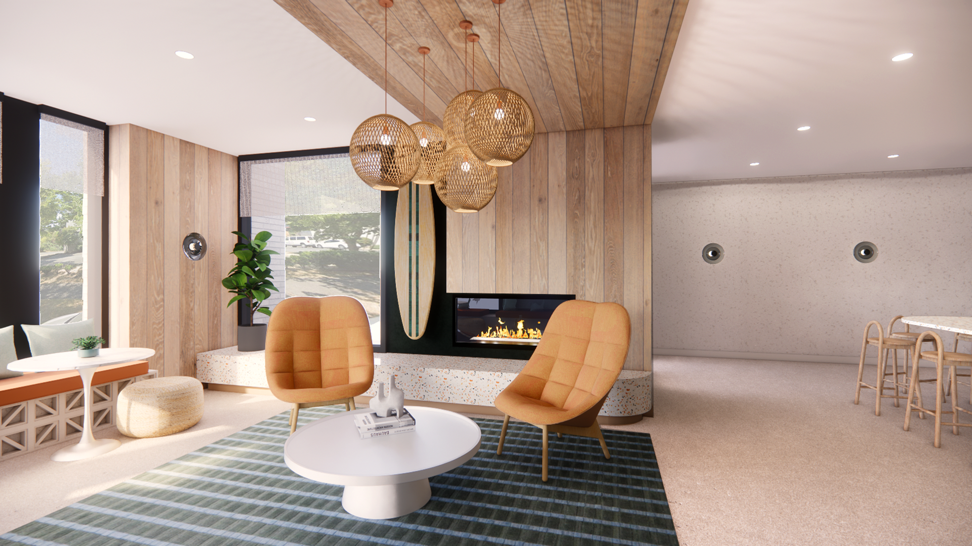 A modern living room with wood paneling, two orange chairs, a coffee table, and a fireplace.
