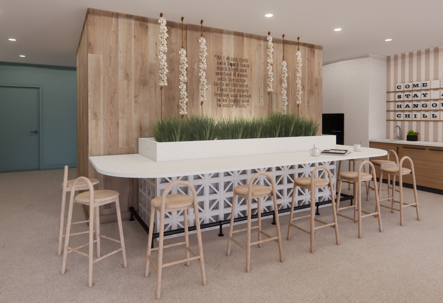 Communal workspace with a long white counter, stools, and a wooden backdrop.