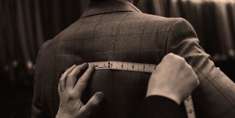 Bespoke history at Stewart Christie & Co. tailoring team measuring a customer
