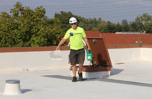 CD Strong employee conducting a roof inspection