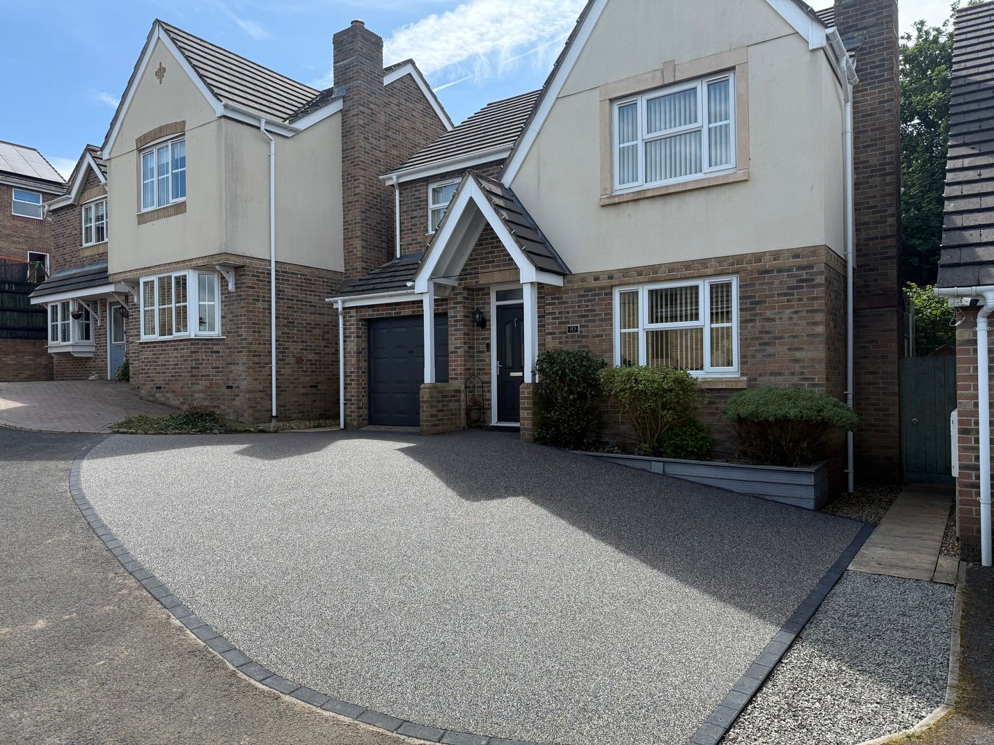 Before and after of small brown resin driveway with block paving border