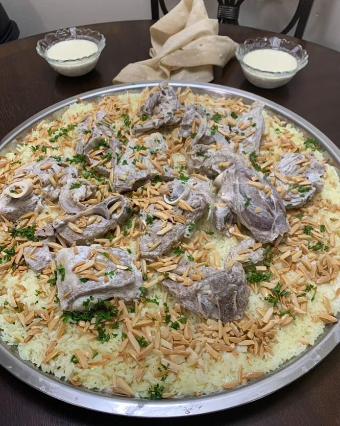 A large tray filled with lots of different types of meat and vegetables.