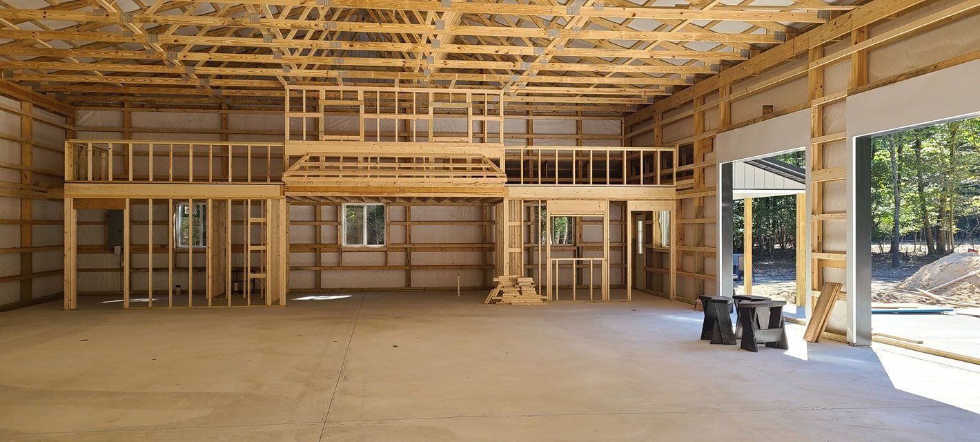 The inside of a building under construction with a balcony.