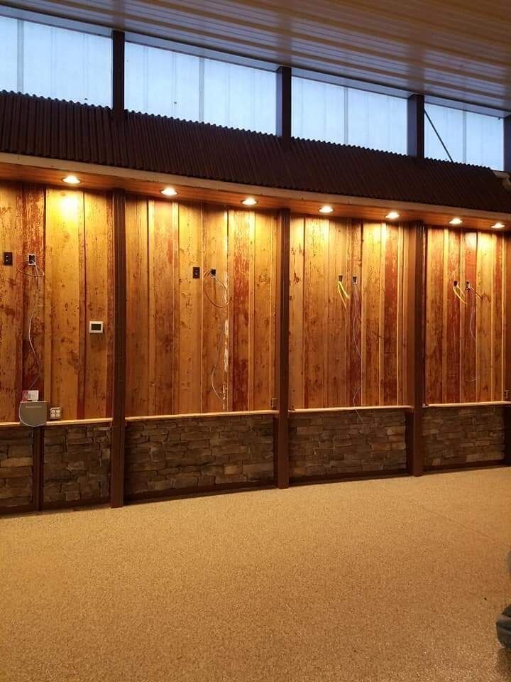 A room with wood paneled walls and a carpeted floor