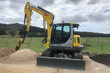 Bulldozer And Soil — Excavation Service in Round Mountain, NSW
