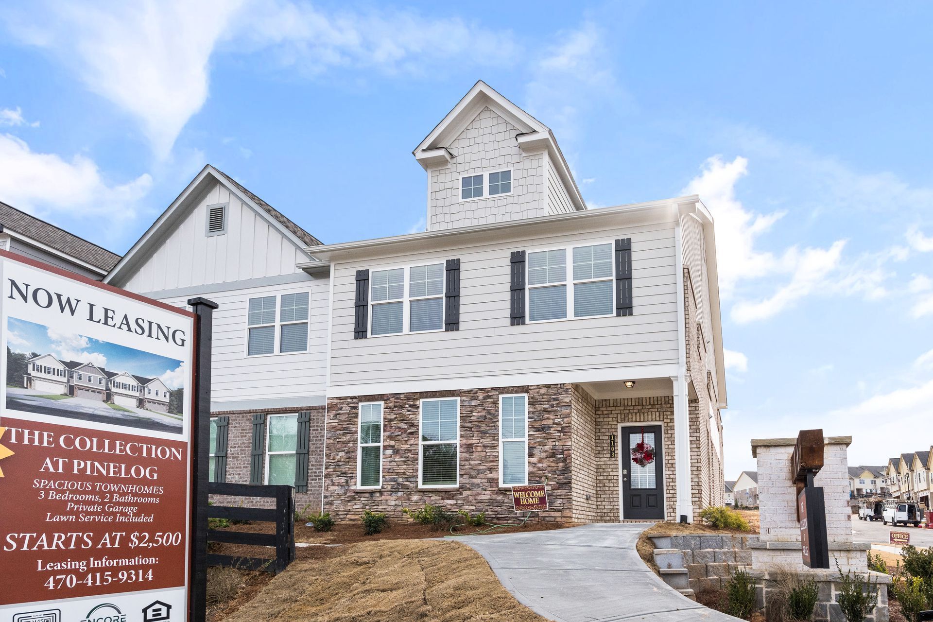 A house with a sign in front of it that says now leasing