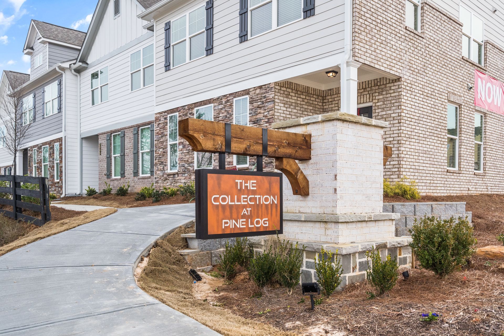 A house with a sign in front of it that says `` the collection at pavilion ''.