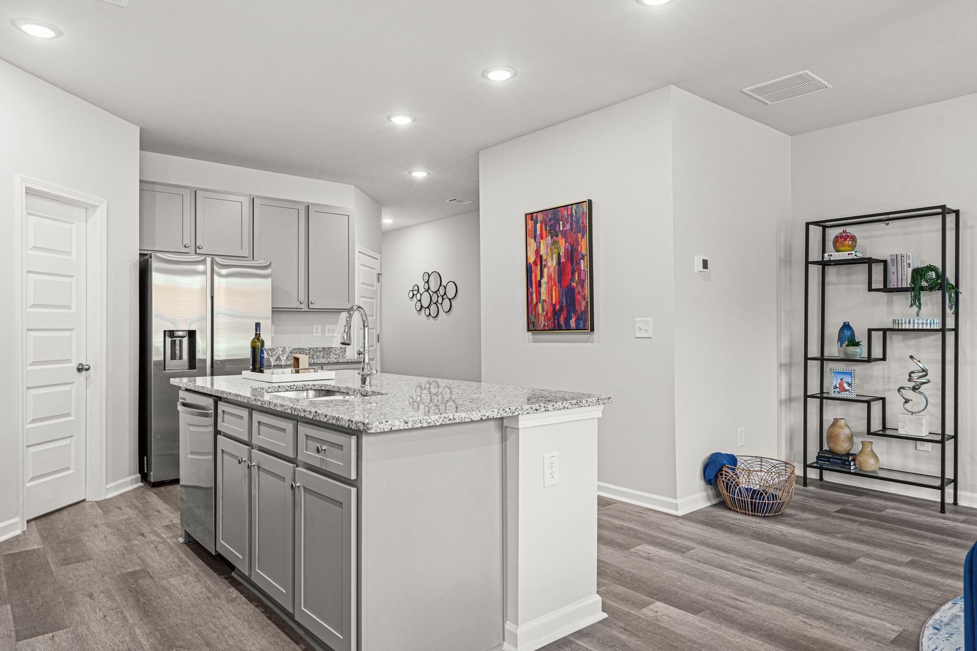 A kitchen with a large island in the middle of the room.