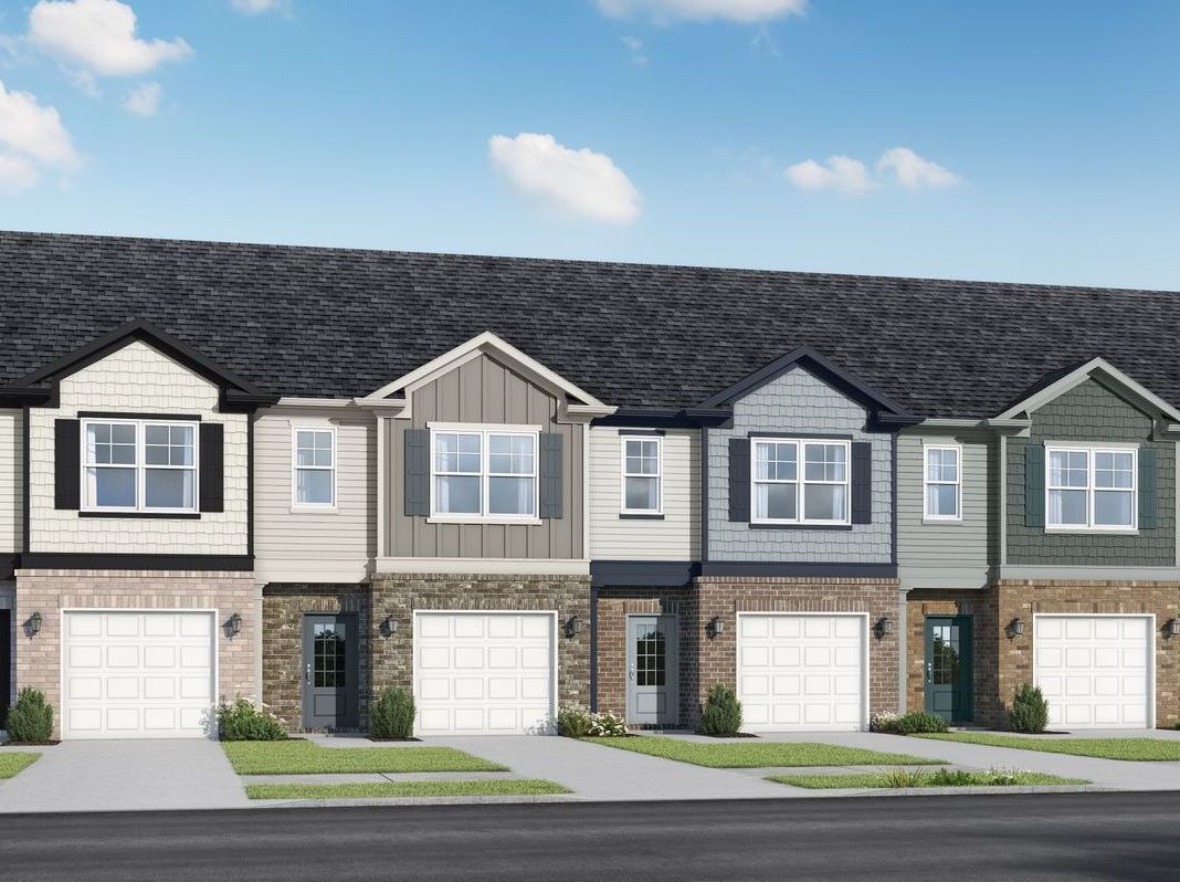 An artist 's impression of a row of houses with garages.