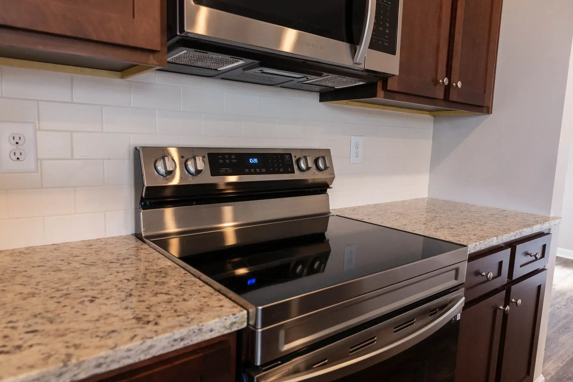 A kitchen with stainless steel appliances and granite counter tops