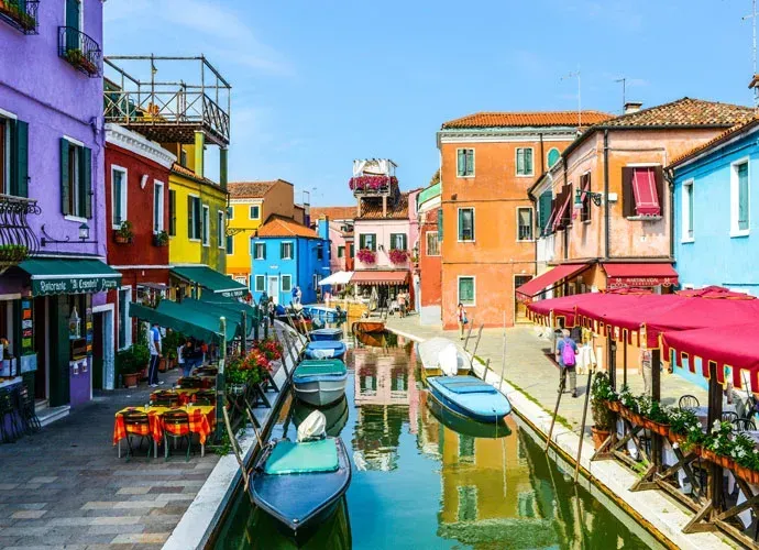Enjoying a private boat excursion to Murano and Burano islands in the Venice lagoon.