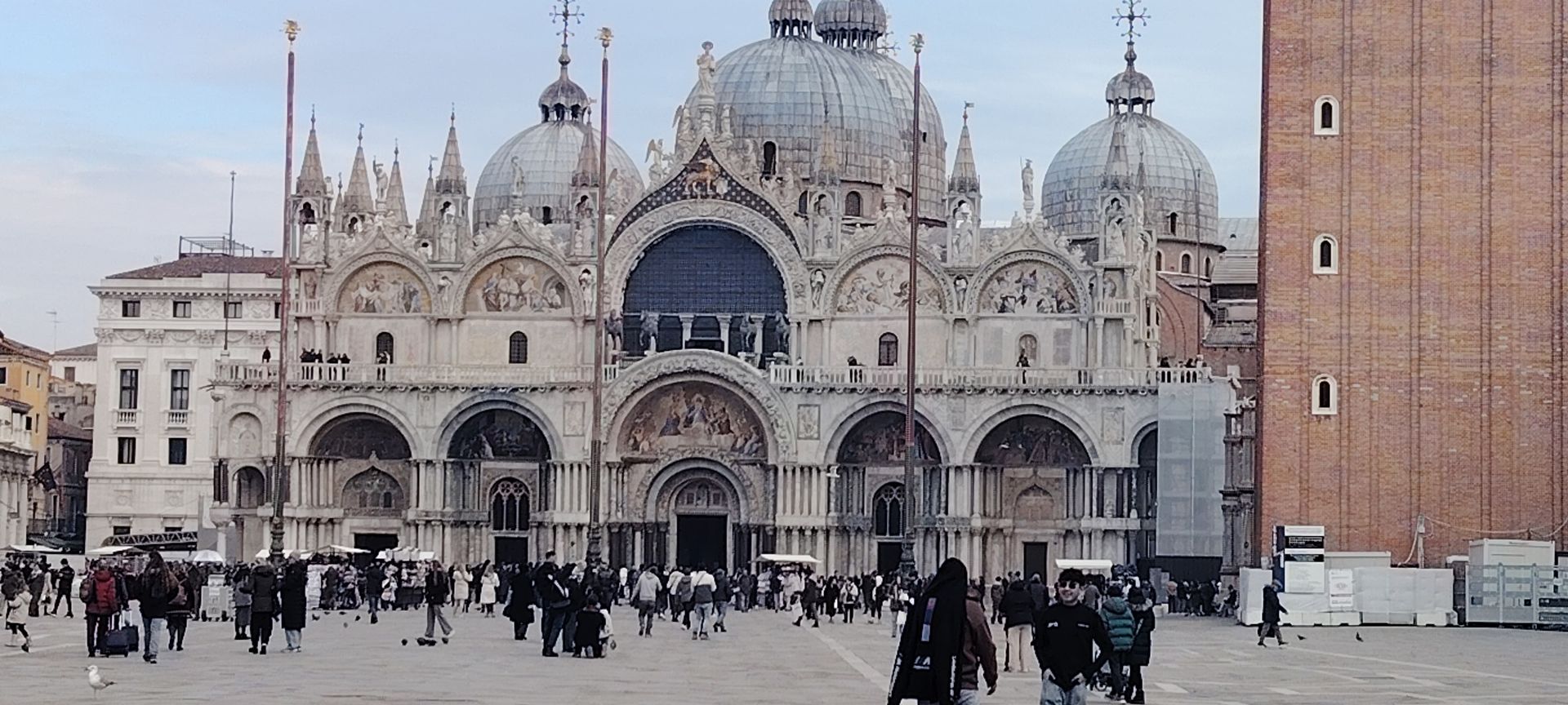 Walking through St. Mark's Square, the heart of Venice, with an official licensed guide to avoid the crowds.
