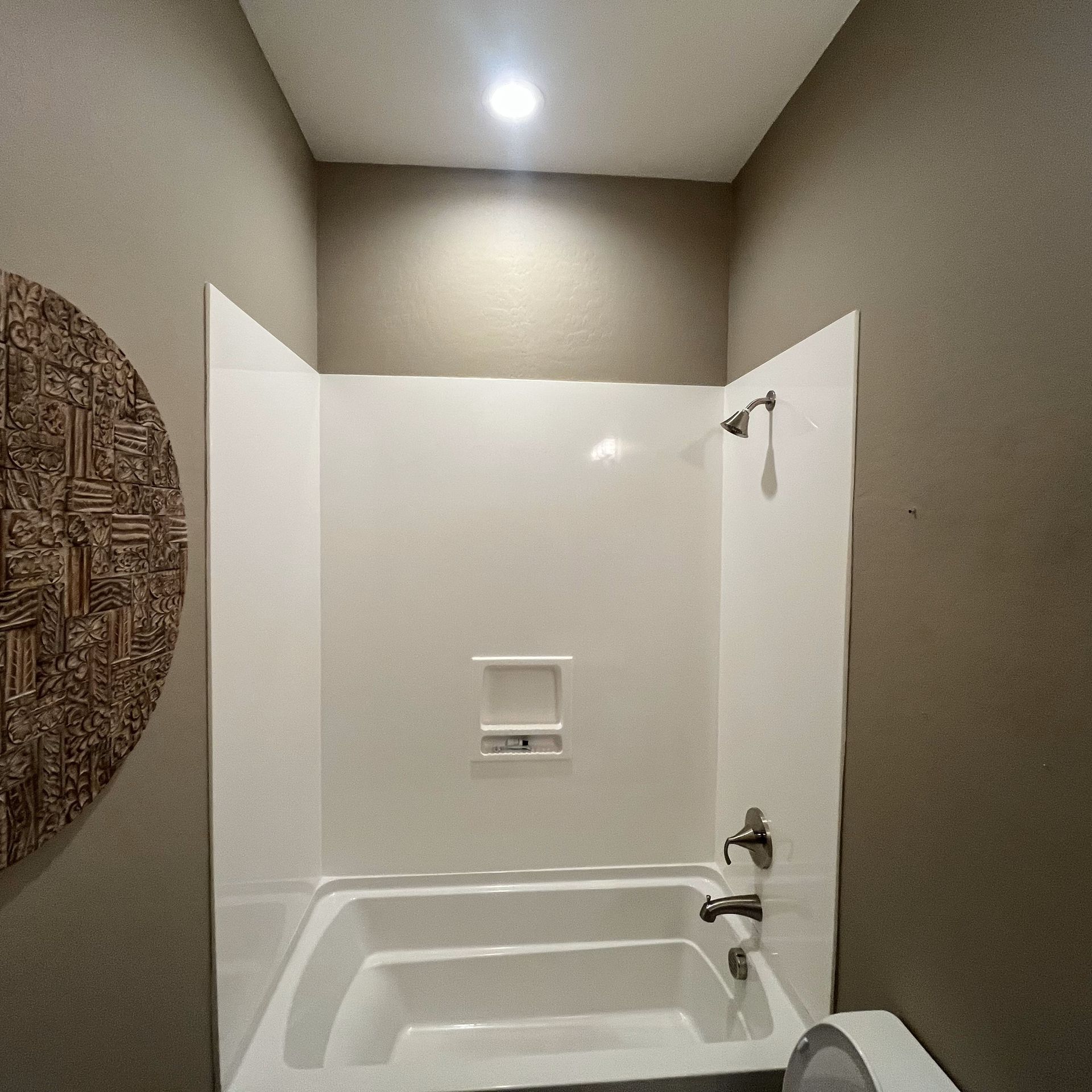 A bathroom with two bathtubs and a toilet
