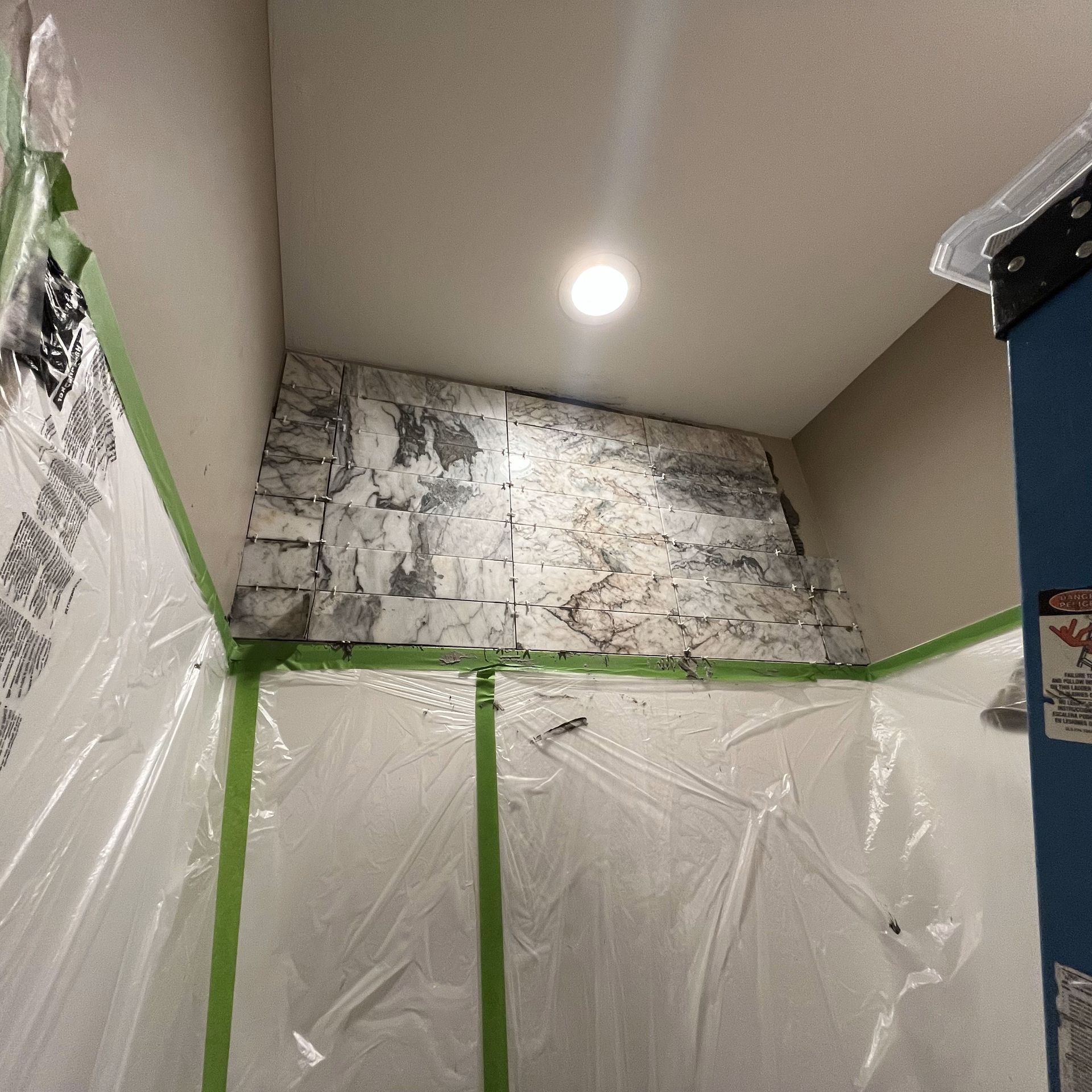 A room with a ceiling that is covered in plastic