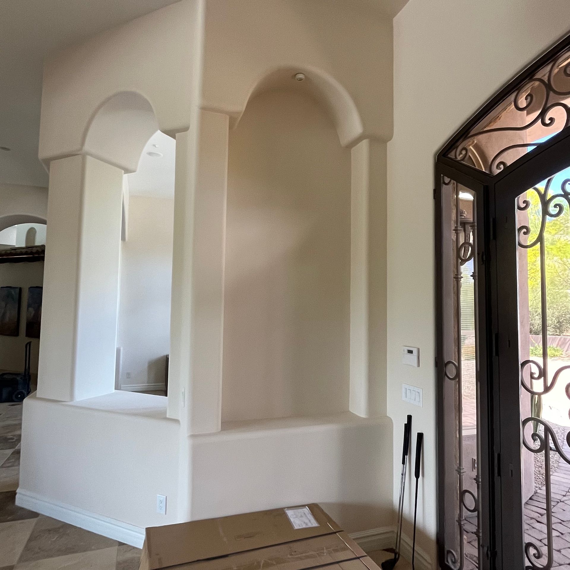 A room with a door and boxes in it.