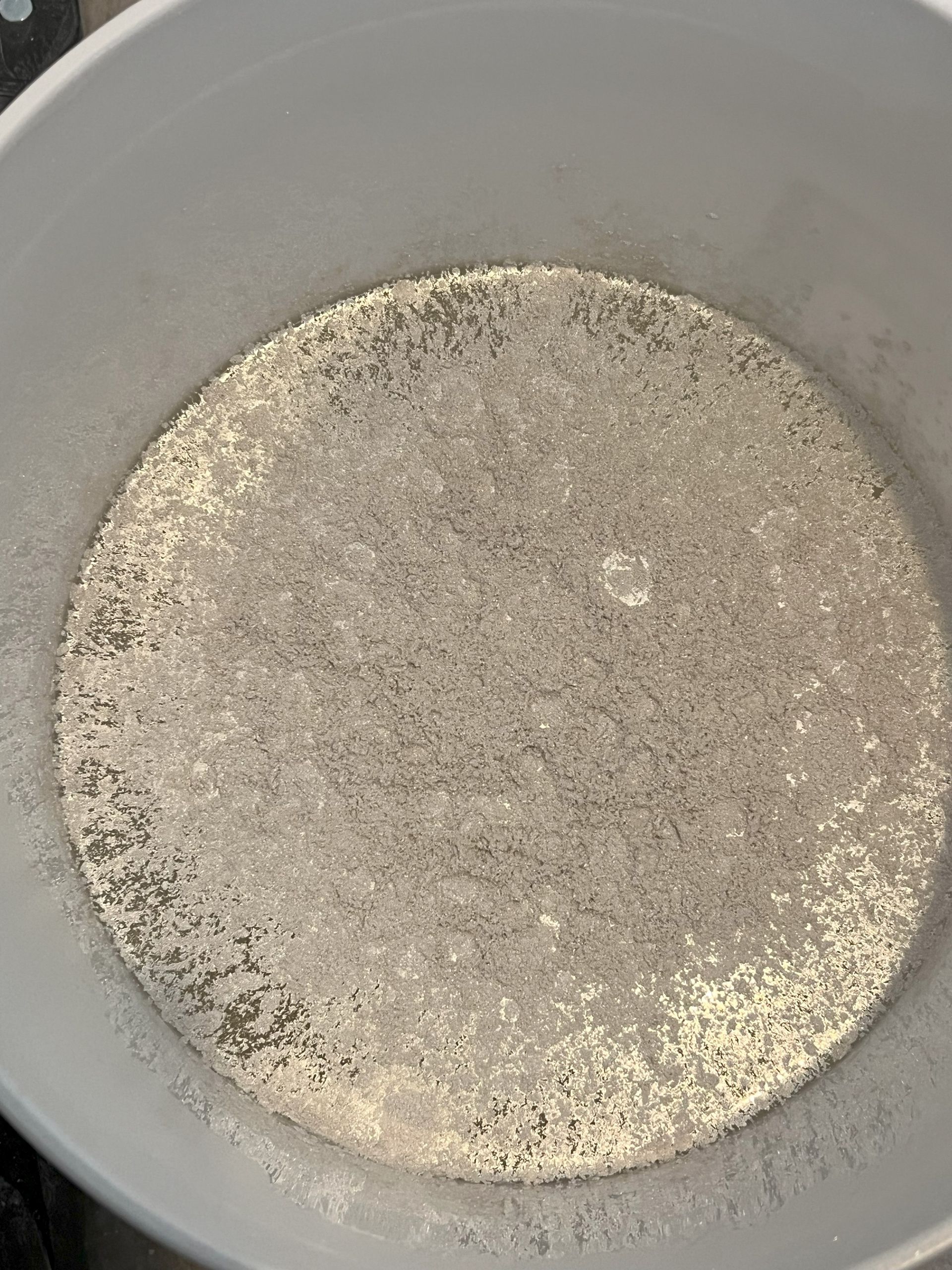 A white bowl filled with a white substance.