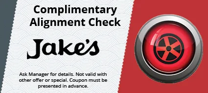 Promotional card for complimentary alignment check at Jake’s, with red tire icon on a white and red background