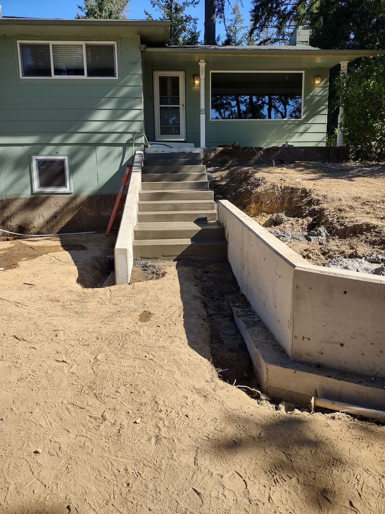 A house with concrete steps leading up to the front door