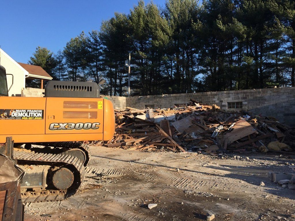 Excavator and debris — Demolition in Sewell, NJ