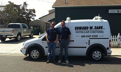Owners with Car Service — Heating and Air- Conditioning Service in Avalon, NJ
