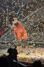 Man in orange dress is singing— Dream ticket in Reston, VA