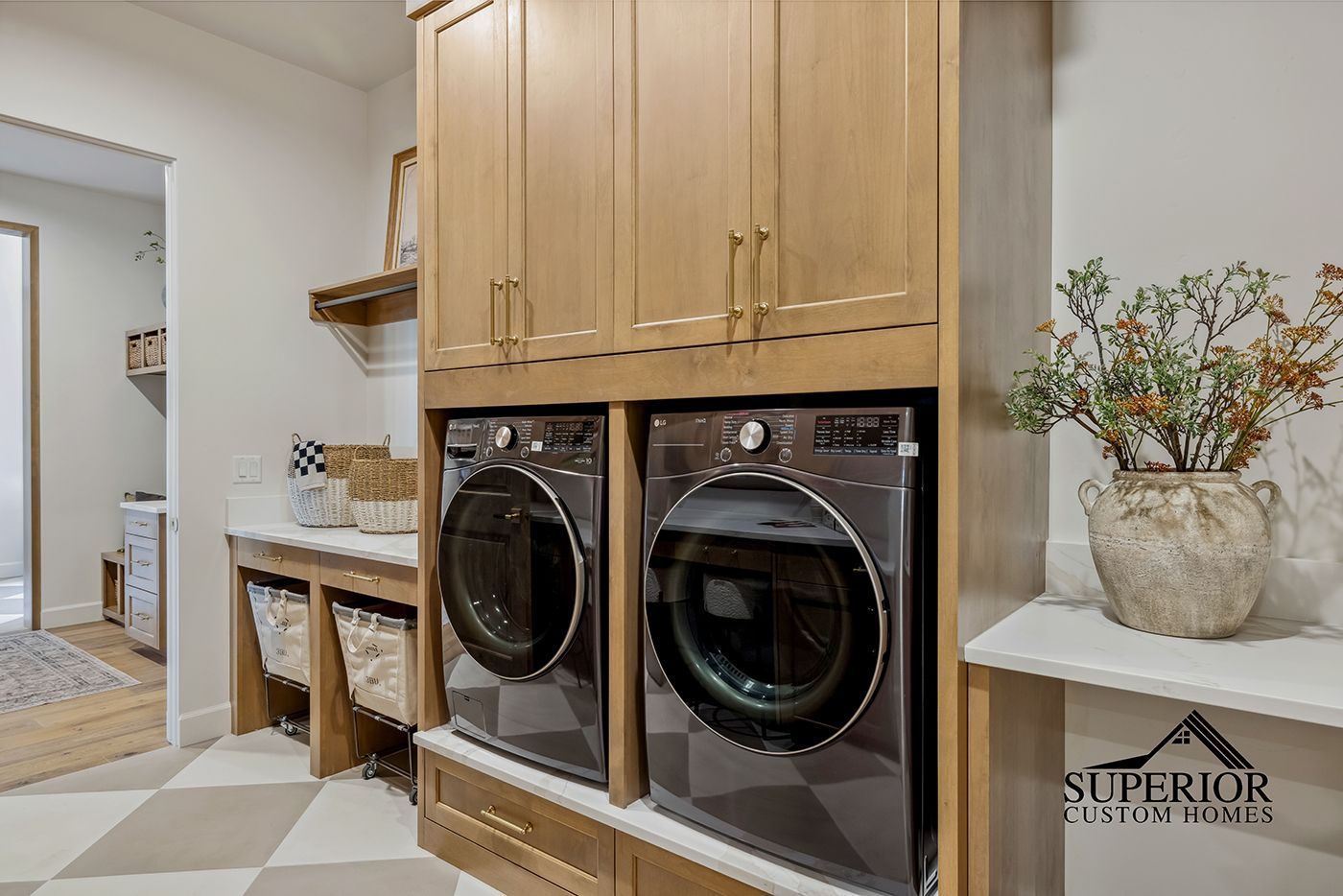 A laundry room with a washer and dryer stacked on top of each other.