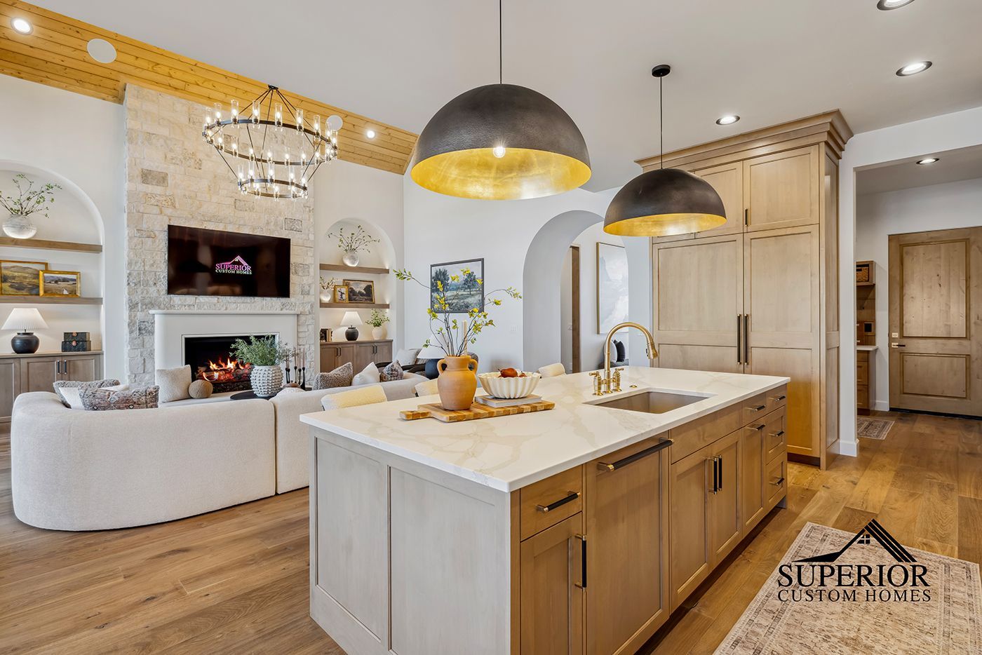 A kitchen with a large island in the middle of the room.