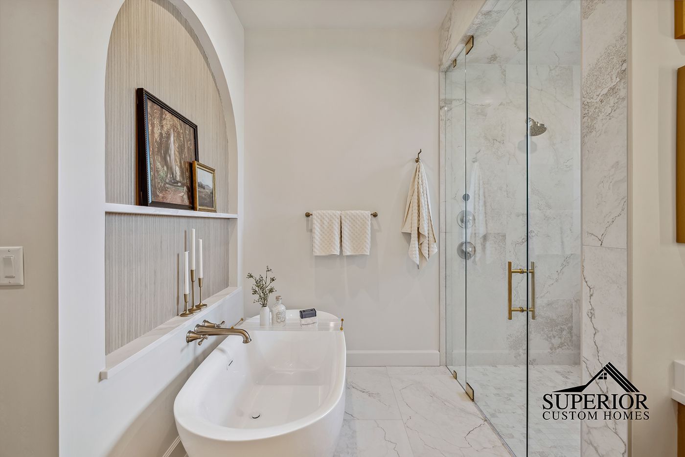 A bathroom with a bathtub and a walk in shower.